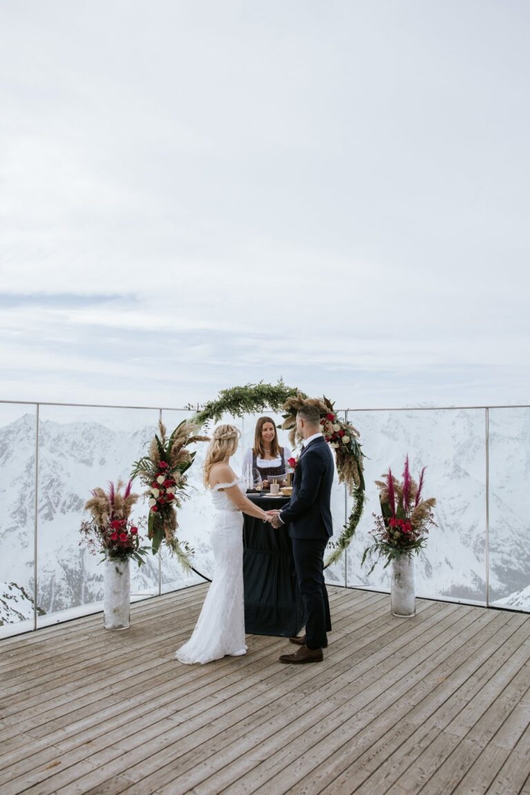 Ceremony beneath a floral ring on the iceQ terrace, Sölden, Getting Married In Austria