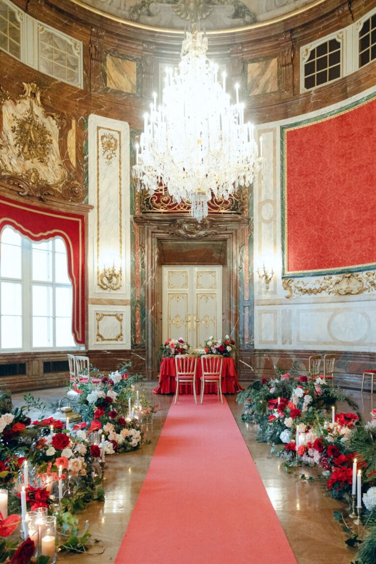 Red-carpeted ceremony hall dressed with florals, Vienna, Getting Married In Austria