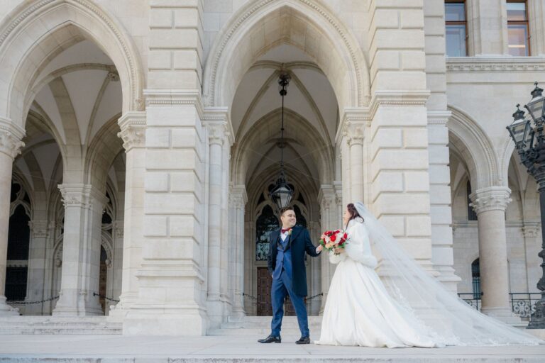 Couple in the arcades of a Vienna building on their Christmas wedding day, Getting Married In Austria