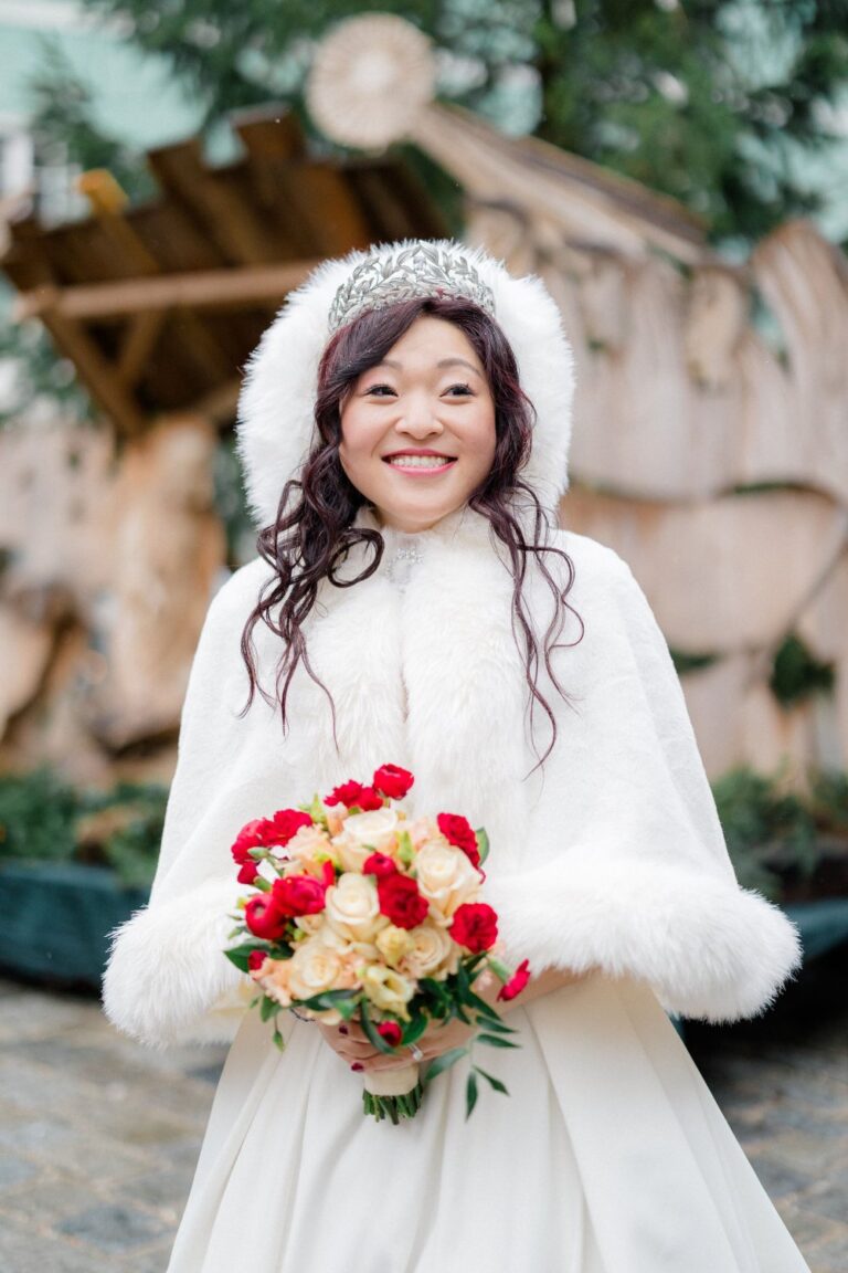 Bride in a winter stole with a bouquet, Hallstatt, Getting Married In Austria