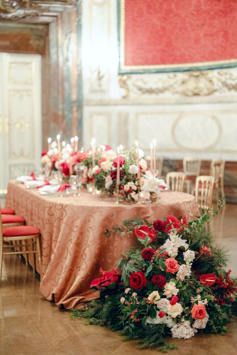 Table dressed in red and blush florals, Vienna Christmas wedding, Getting Married In Austria