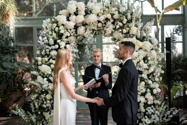 Vows beneath a white flower arch in the glasshouse at Beldi Country Club, Marrakech, Giandomenico Cosentino Photography