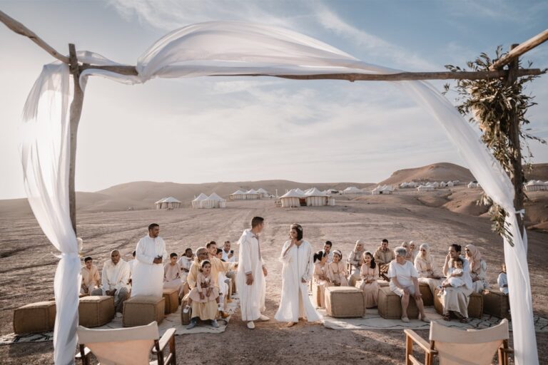 A ceremony under a draped canopy in the Agafay desert at Scarabeo Camp, outside Marrakech, Giandomenico Cosentino Photography