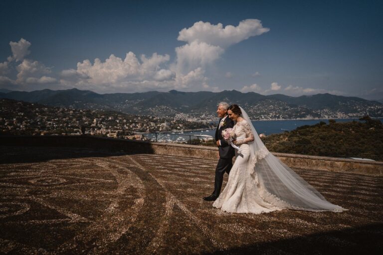 A couple on a headland above the Ligurian coast after their wedding at Villa Durazzo, Santa Margherita Ligure, Giandomenico Cosentino Photography