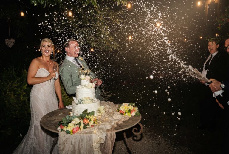Champagne sprayed over the couple at the cake, Giuliano Bausano
