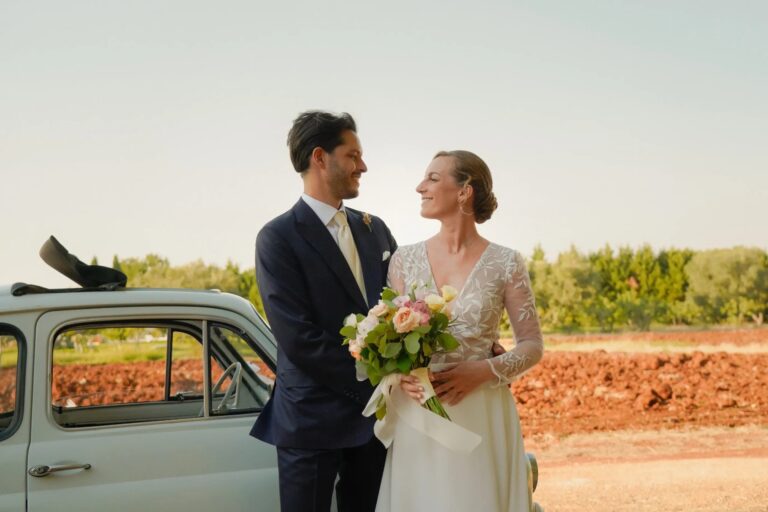 The couple beside a vintage Fiat 500 at golden hour, Puglia, Giuseppe Suma Weddings