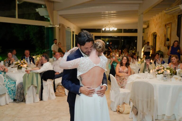 The couple embrace on the dance floor among the dinner tables, Puglia, Giuseppe Suma Weddings