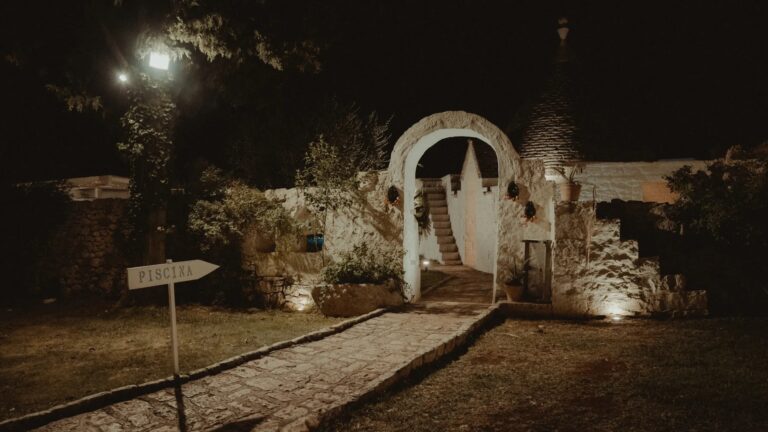 A lit stone archway and trullo at night, Valle d'Itria, Puglia, Giuseppe Suma Weddings