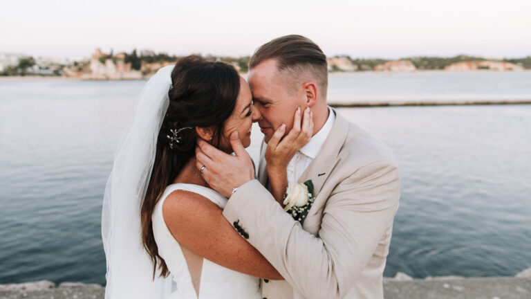 Couple at the water's edge on the Algarve coast, Glamour Algarve Weddings