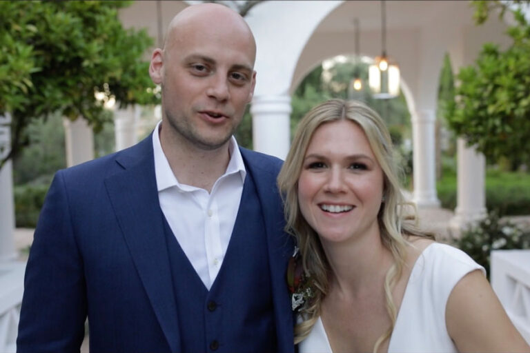 Couple portrait beneath a white arched arcade, Glamour Algarve Weddings