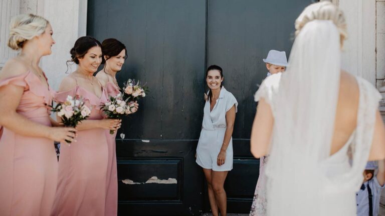 Bridesmaids and the bride by a dark door, Algarve, Glamour Algarve Weddings