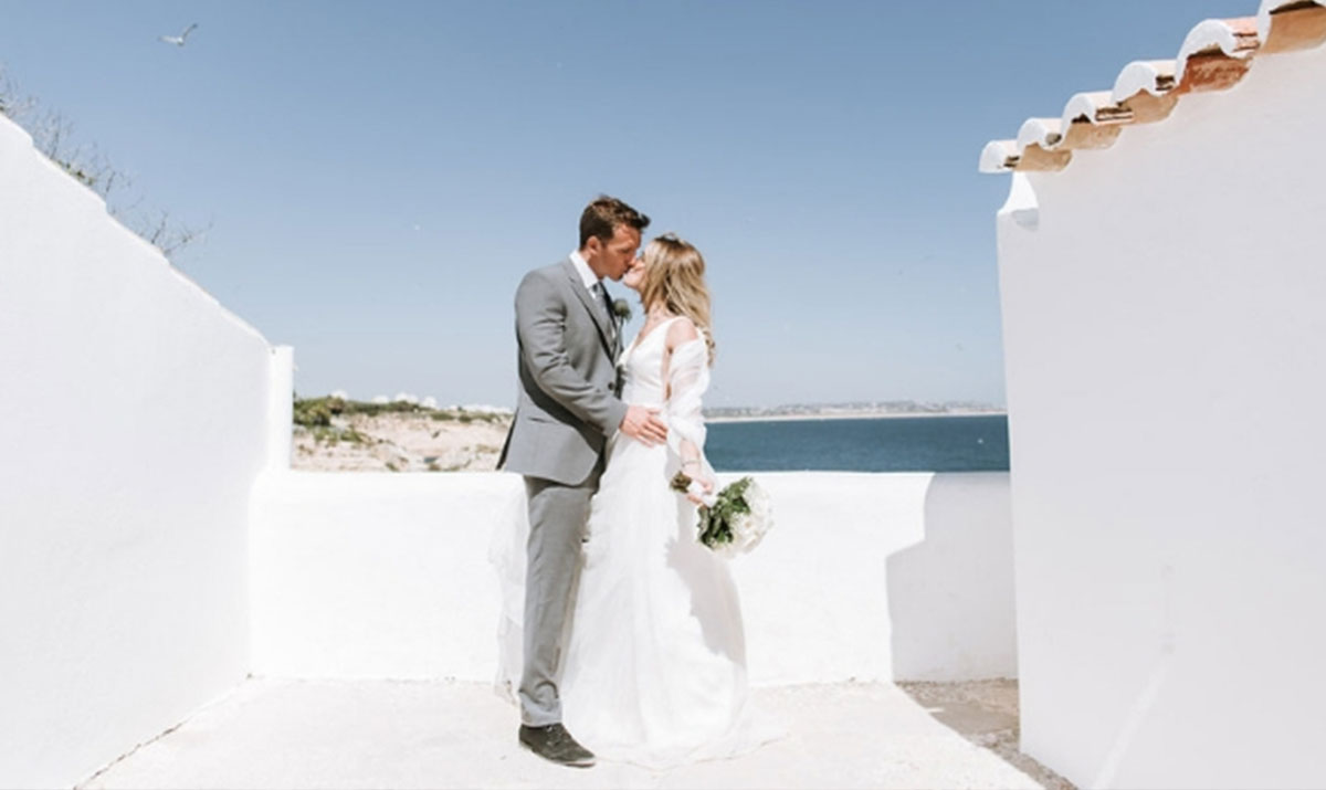 Couple on a whitewashed terrace above the Algarve coast, Glamour Algarve Weddings