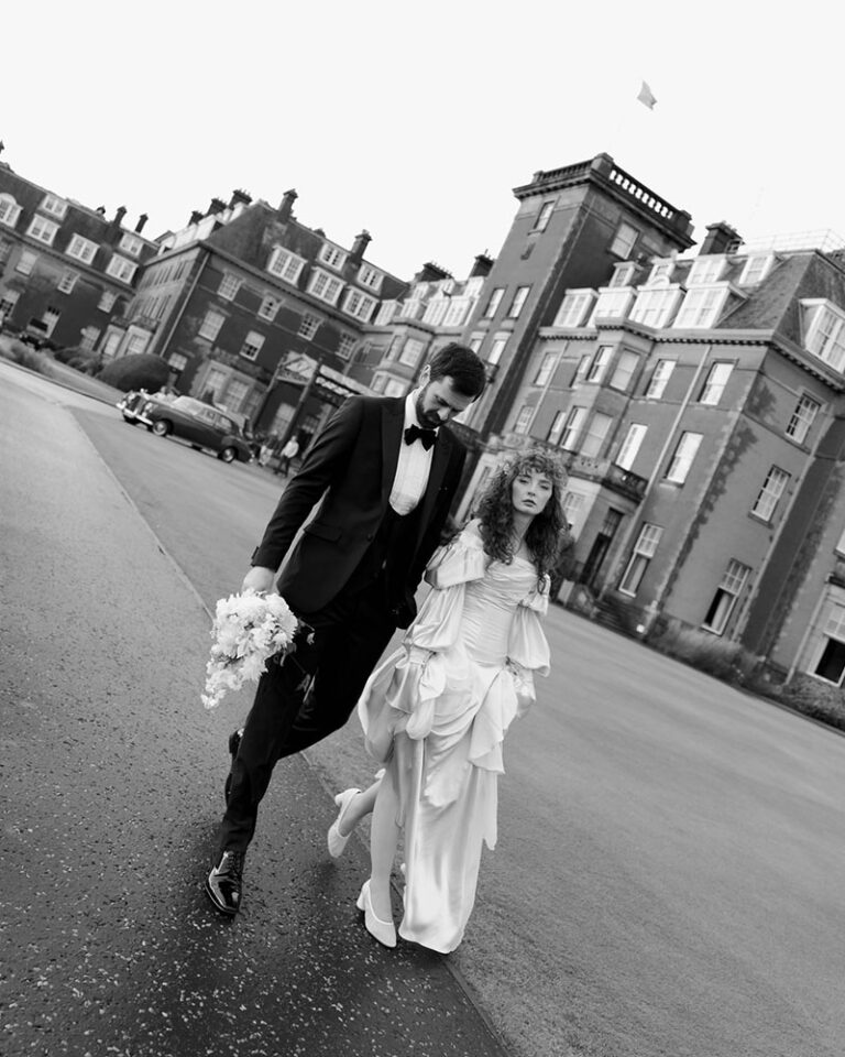 A couple walking in front of the hotel, Gleneagles