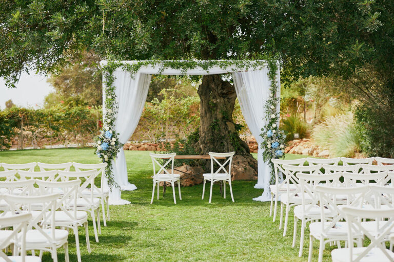 Ceremony canopy of white drapes and greenery under an old tree, Go2Wonderland