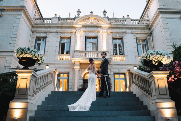 Bride and groom on the illuminated steps of the venue in the evening, Pernes-les-Fontaines, Vaucluse, Gordon Wedding Films