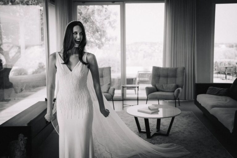 Black and white portrait of a bride laughing in a modern villa before her elopement, Sicily, Gordon Wedding Films