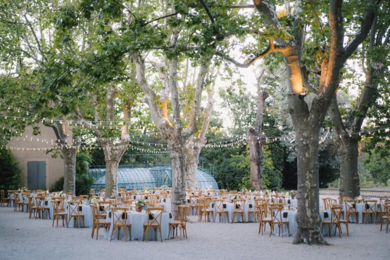 Dinner tables laid beneath the plane trees, Château de Valmousse, Provence, Gordon Wedding Films