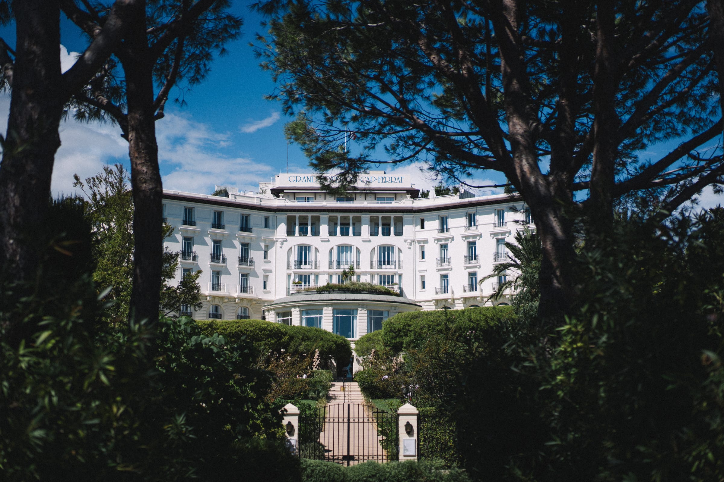 The Grand-Hôtel du Cap-Ferrat seen through its pine gardens, Saint-Jean-Cap-Ferrat, French Riviera, Gordon Wedding Films