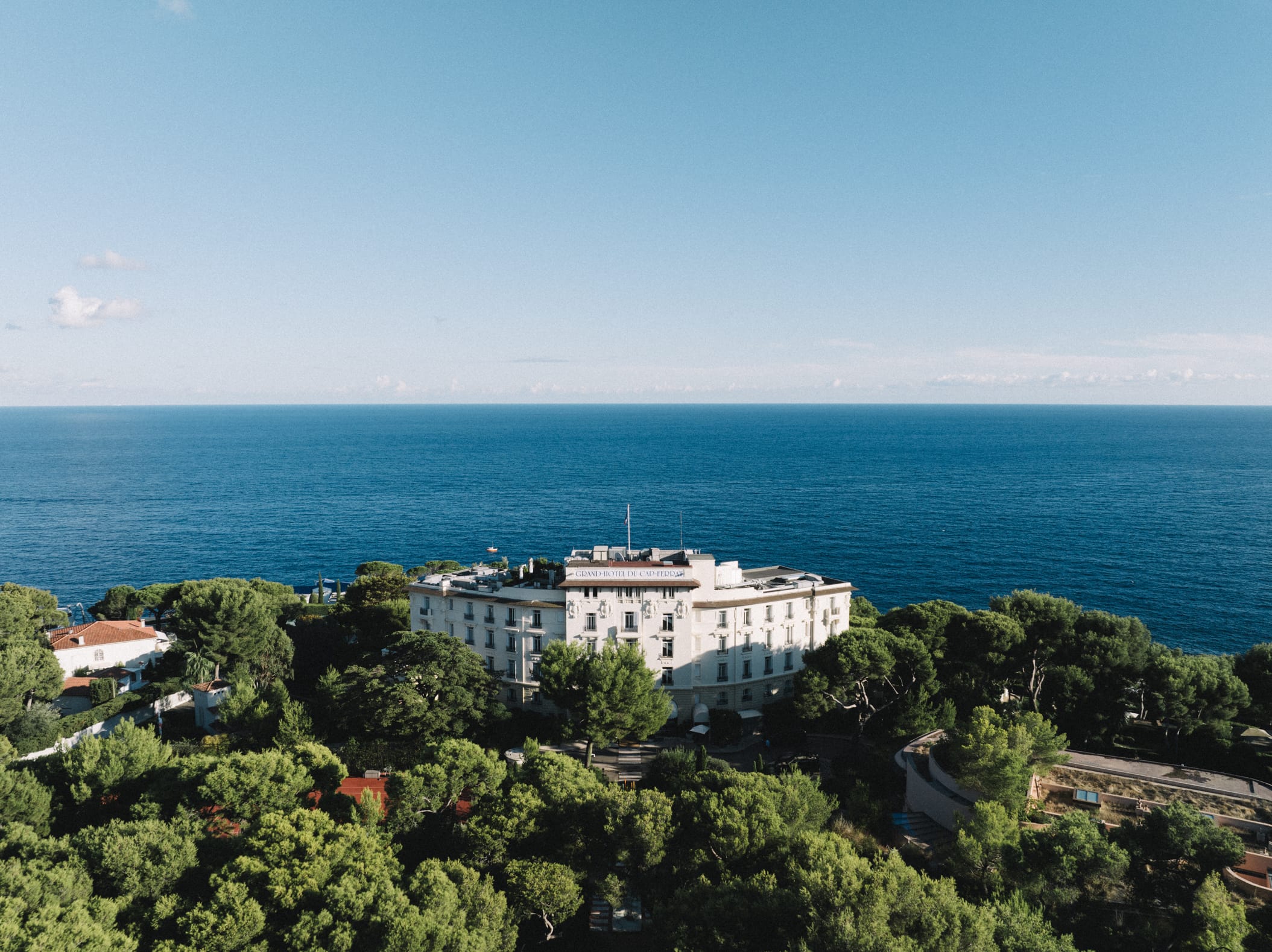 Aerial view of the Grand-Hôtel du Cap-Ferrat above the Mediterranean, French Riviera, Gordon Wedding Films