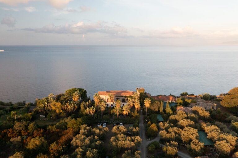 Aerial view of the villa above the sea at sunset during Nicoletta and Connor's elopement, Taormina, Sicily, Gordon Wedding Films