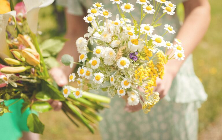 Bridesmaids holding bouquets of daisies and wildflowers, Gorgeous Films