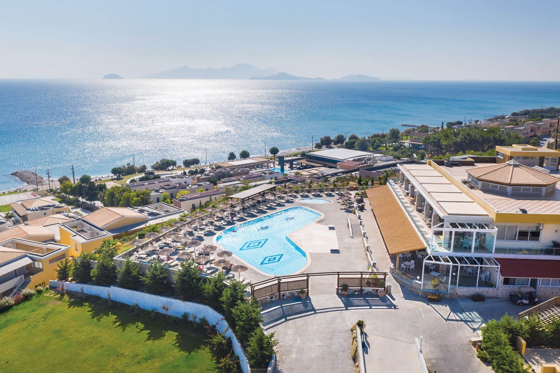 Aerial view of the hotel and its pools above the sea, Grand Blue Kos Hotel