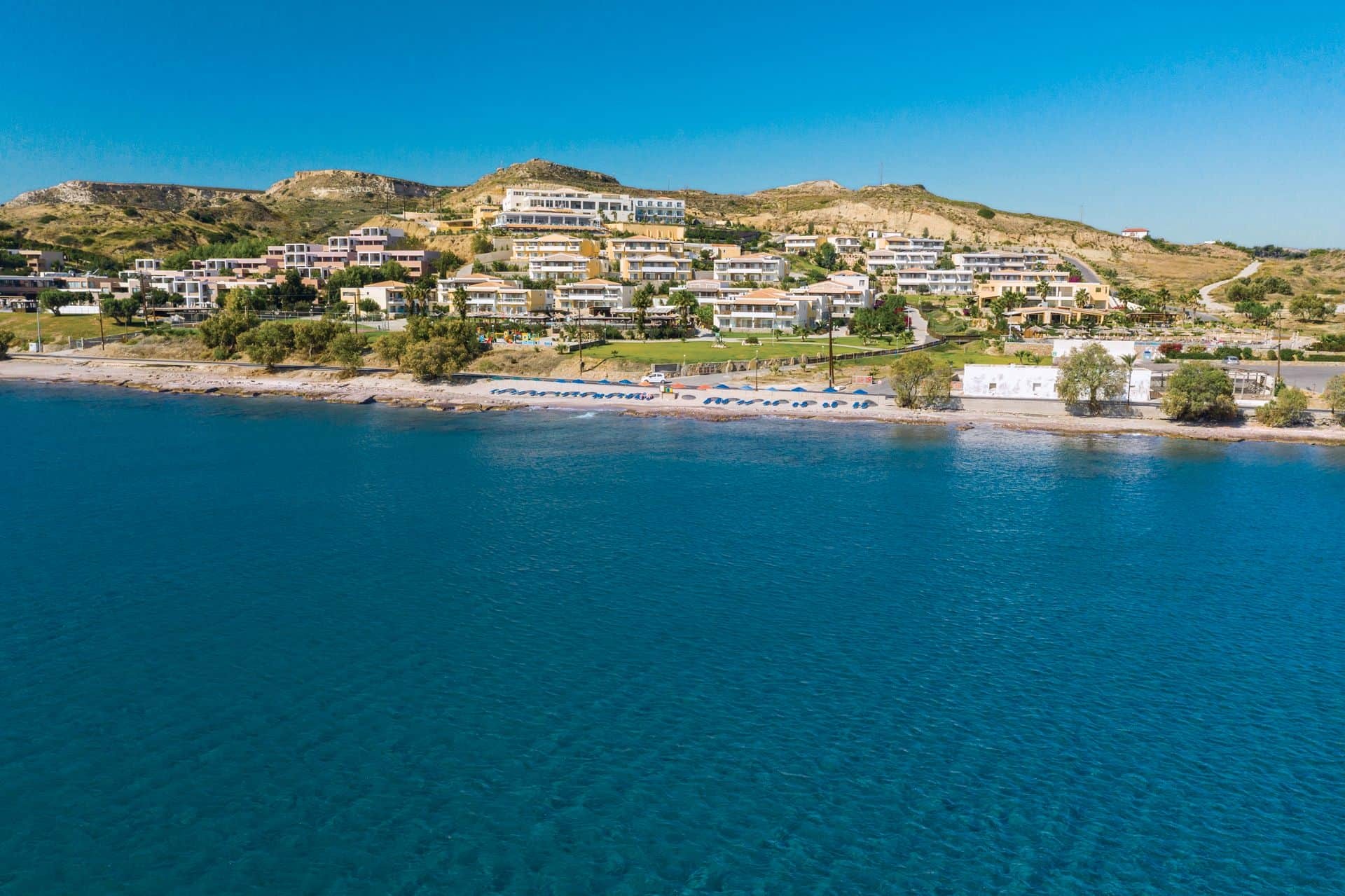 The hotel on its hillside seen from the water, Grand Blue Kos Hotel