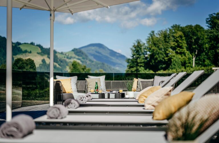 Sun terrace with loungers and mountain views, Grand Tirolia Kitzbuhel