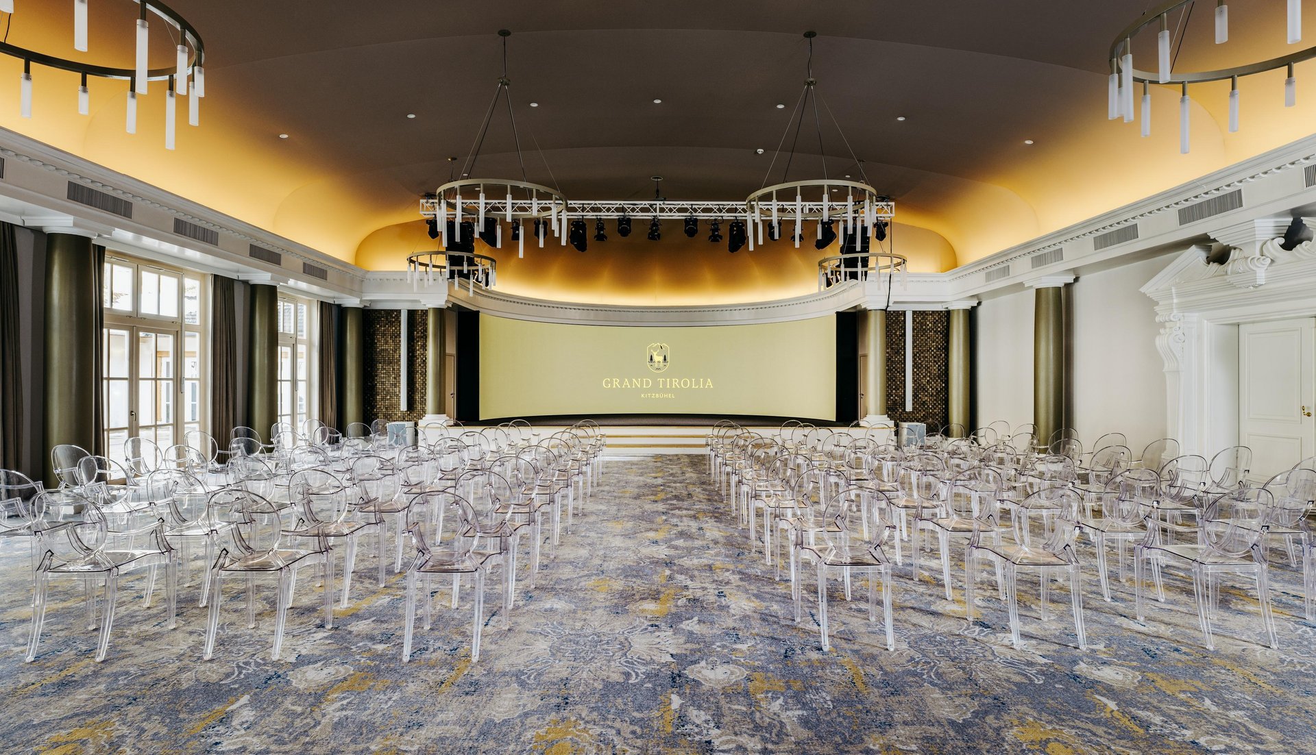 The Atrium set theatre-style with stage and screen, Grand Tirolia Kitzbuhel