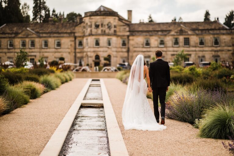 A couple walking up the rill garden path towards the Hall, seen from behind, Grantley Hall
