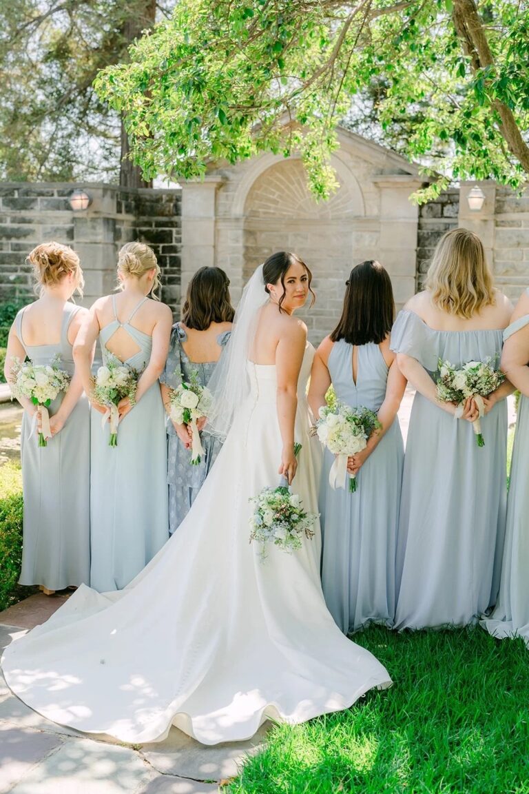 A bride with her bridesmaids at the garden wall, courtesy of One & Only Production, Greystone Mansion