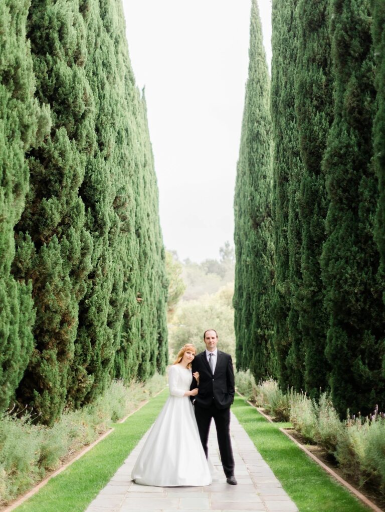 A bride turns down the cypress allee, courtesy of Danforth Neal Photography, Greystone Mansion