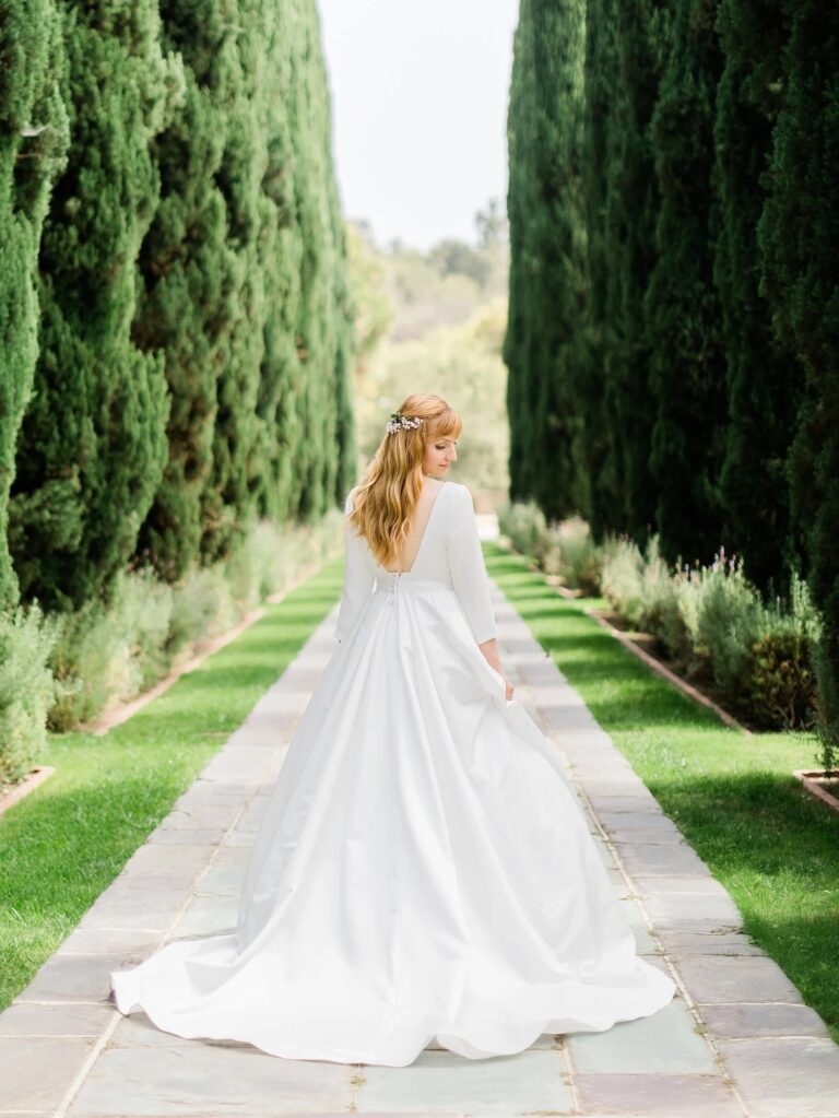 A bride walking the cypress allee, courtesy of Danforth Neal Photography, Greystone Mansion