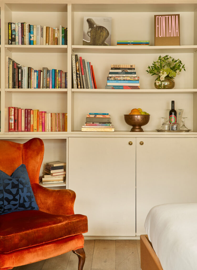 Double room with a bookcase wall