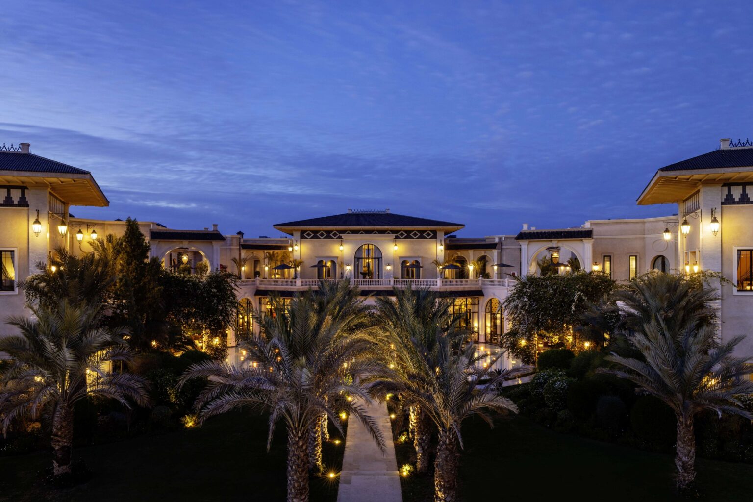 The palace and its gardens at dusk