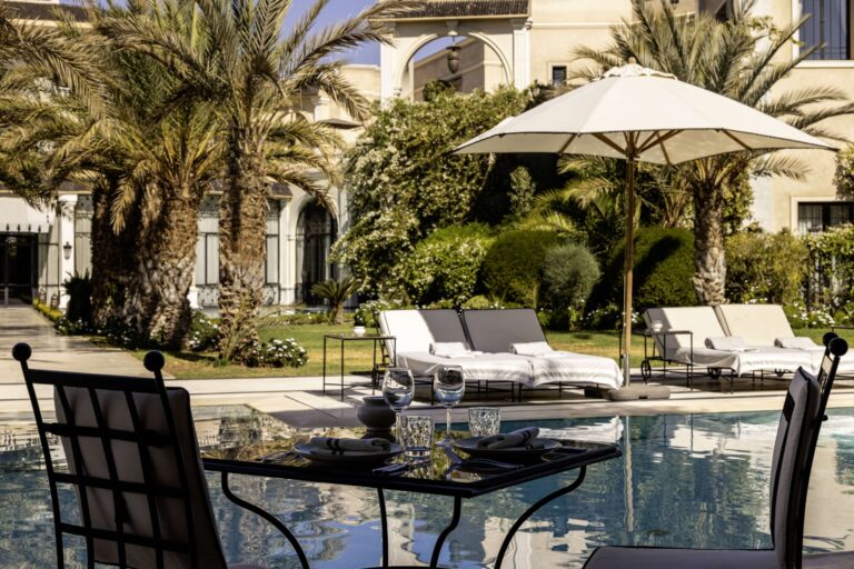 A table beside the pool, Hôtel Palais Ronsard Relais & Châteaux