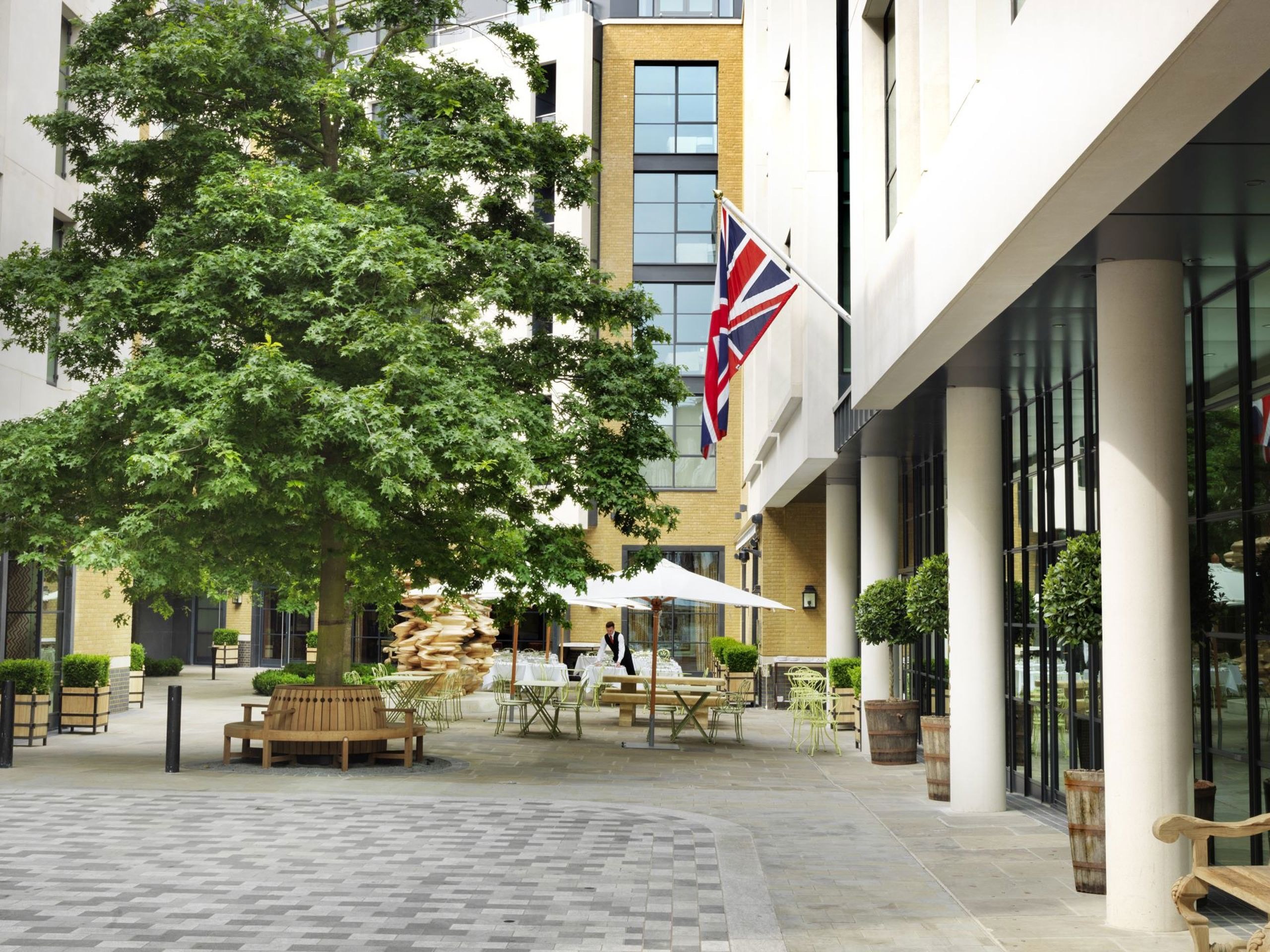 Exterior of the hotel on its tree-lined courtyard in Soho, Ham Yard Hotel