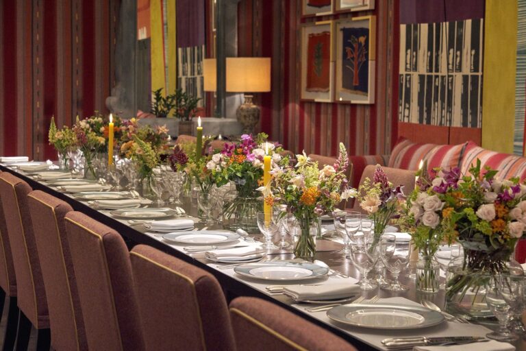 A long table laid for dinner in the Sherwood Room, Ham Yard Hotel