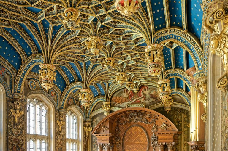 The Chapel Royal's vaulted ceiling, deep blue studded with gold stars and gilded pendants, Hampton Court Palace