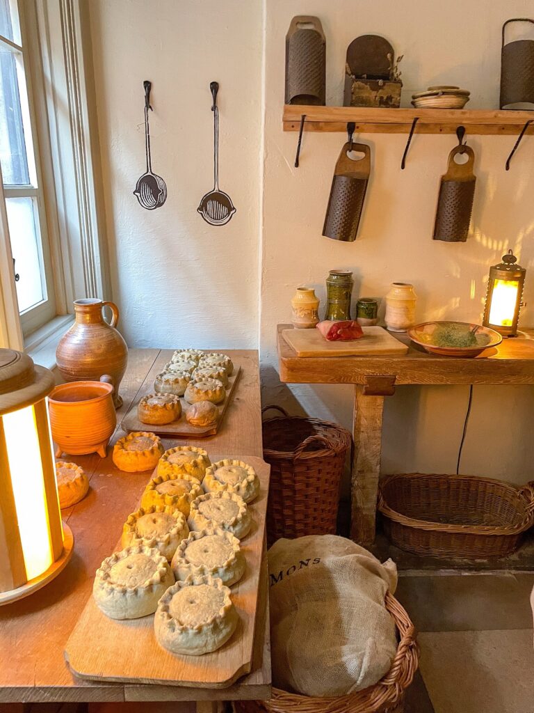 Henry VIII's Historic Kitchens, a lantern-lit table of freshly baked bread, Hampton Court Palace