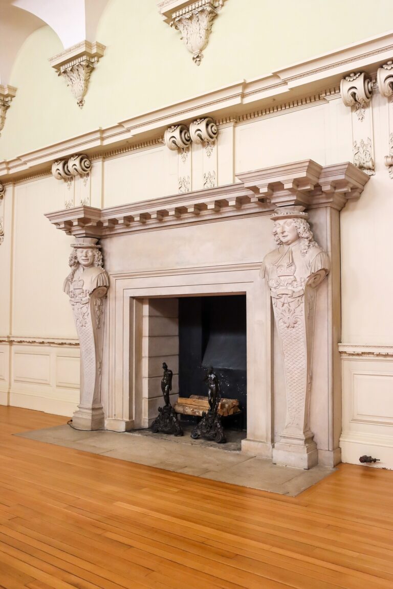 A carved stone chimneypiece in one of the palace's Baroque state apartments, Hampton Court Palace