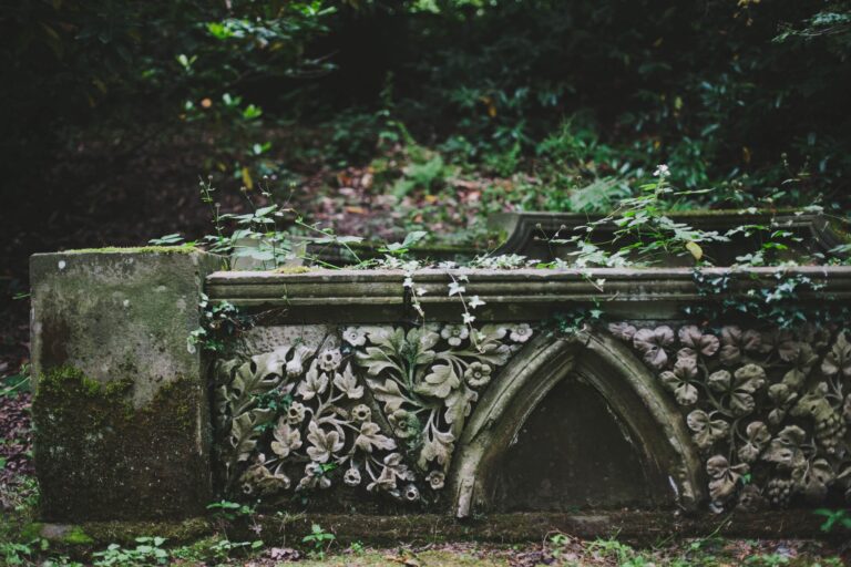 An ivy-covered stone garden feature, weathered and green, Hampton Manor