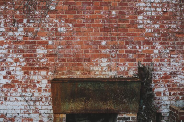 A weathered brick wall with a rustic console, the texture of the old estate buildings, Hampton Manor