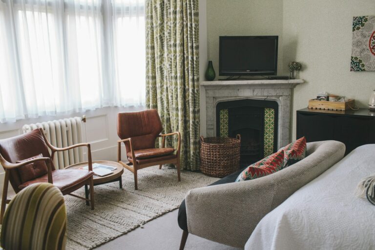 A suite sitting room with sofas and armchairs for gathering, Hampton Manor
