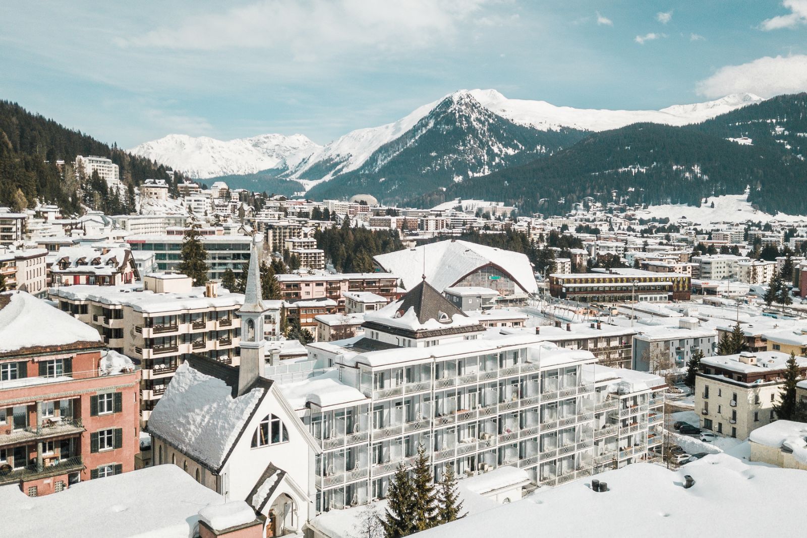 The hotel and Davos under snow, with the Alps beyond, Hard Rock Hotel Davos