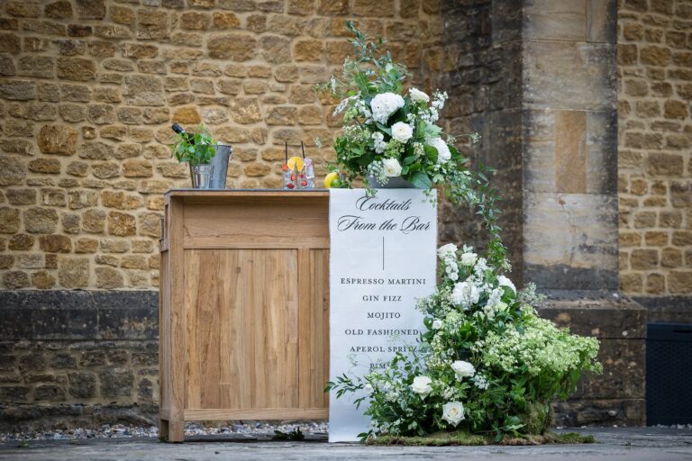 A cocktail bar, dressed with garden flowers against hamstone, Haselbury Mill