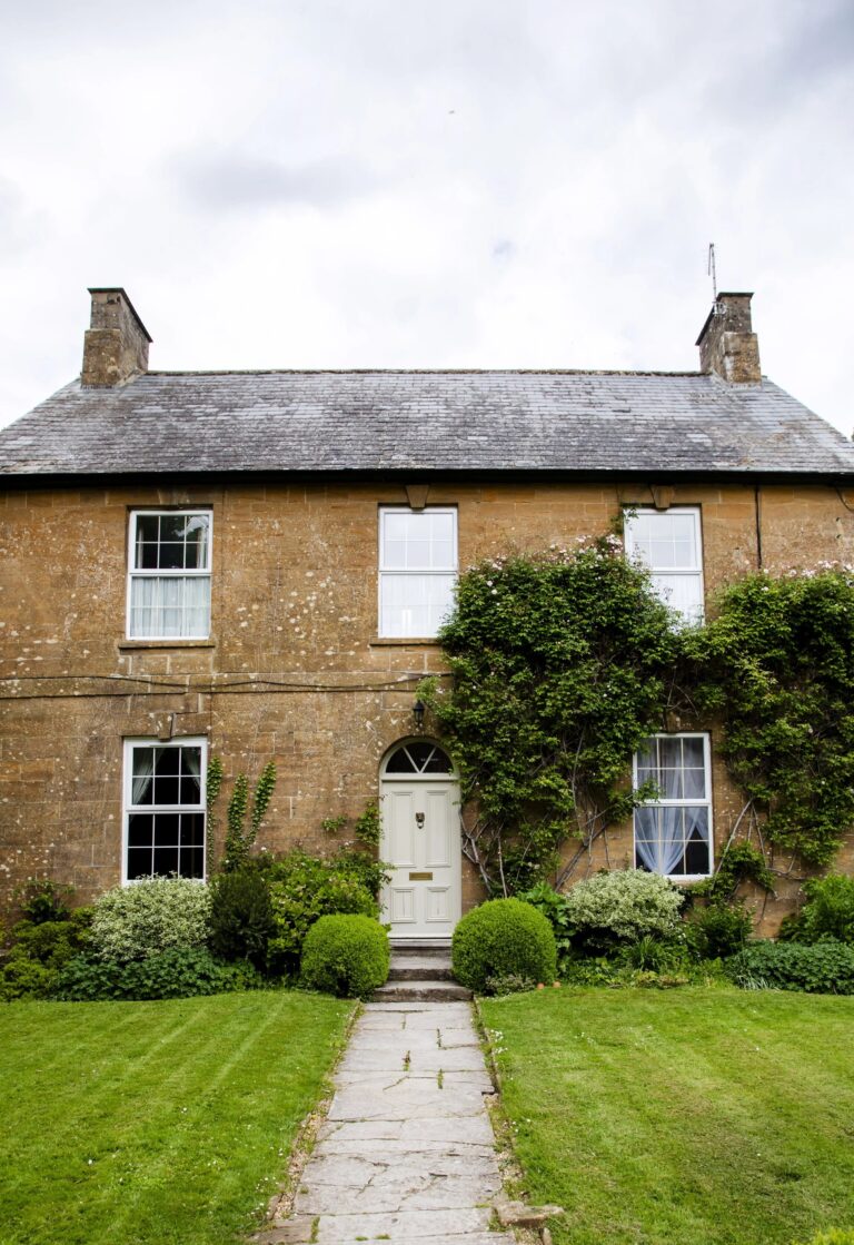 One of the estate's hamstone buildings, honey-coloured in the Somerset light, Haselbury Mill