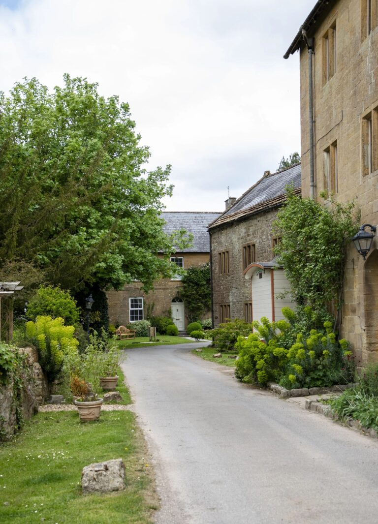 The estate lane between the hamstone buildings, Haselbury Mill