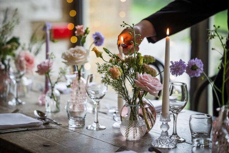 A candlelit tablescape with spring flowers, Haselbury Mill