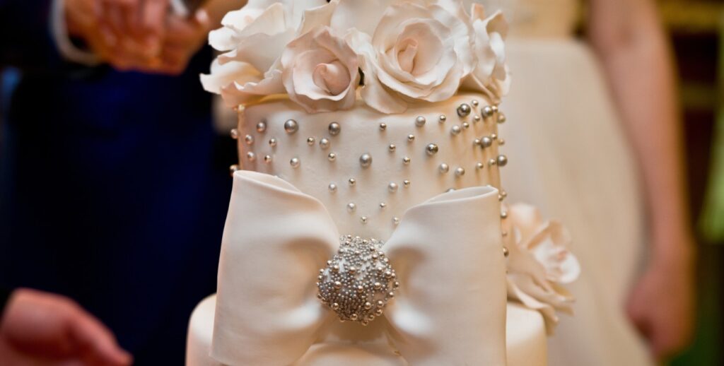 An iced wedding cake decorated with roses, Hatfield House